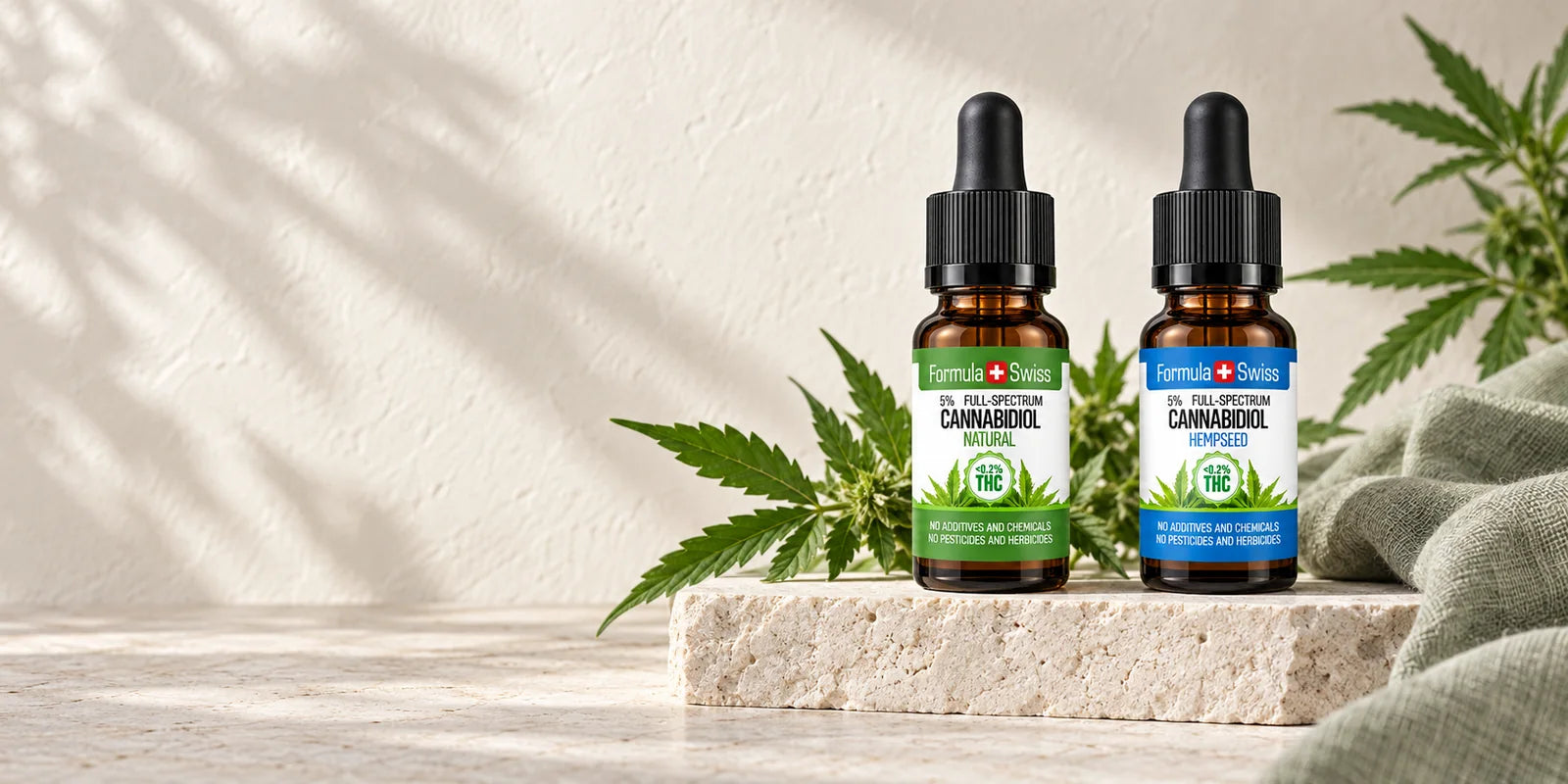 Flaconi di olio di CBD Formula Swiss su pietra chiara