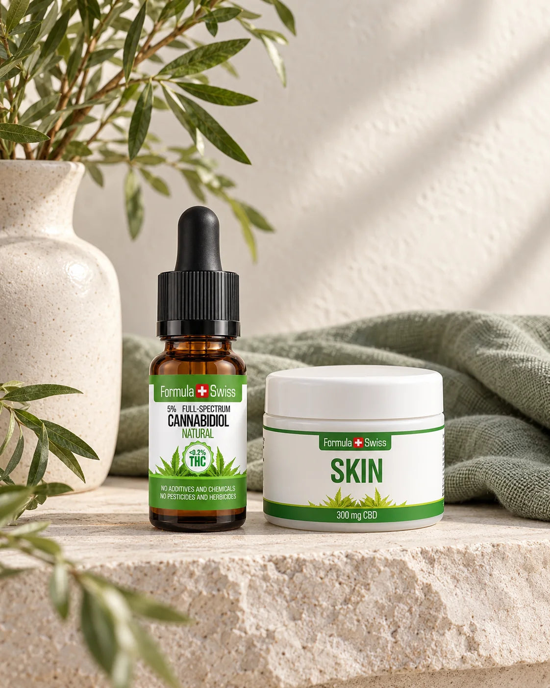 Olio di CBD e Skin Balm Formula Swiss su pietra chiara con tessuto di lino verde salvia